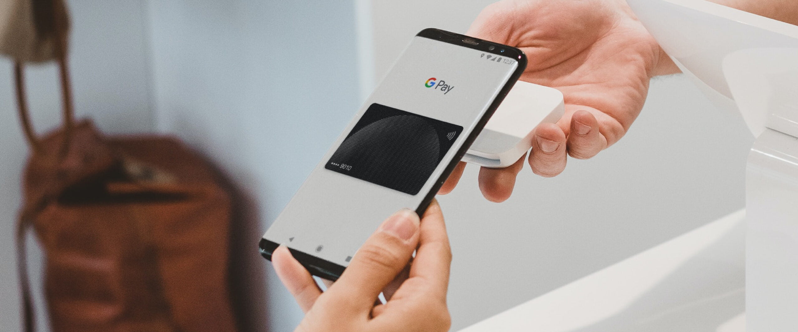 Someone paying with Google Pay